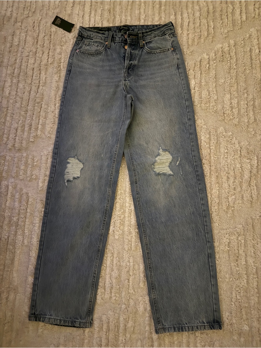 Denim jeans button fly , high rise , straight distressed, new with tags size 4